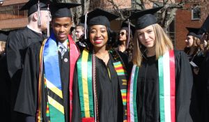 international students in graduation sashes